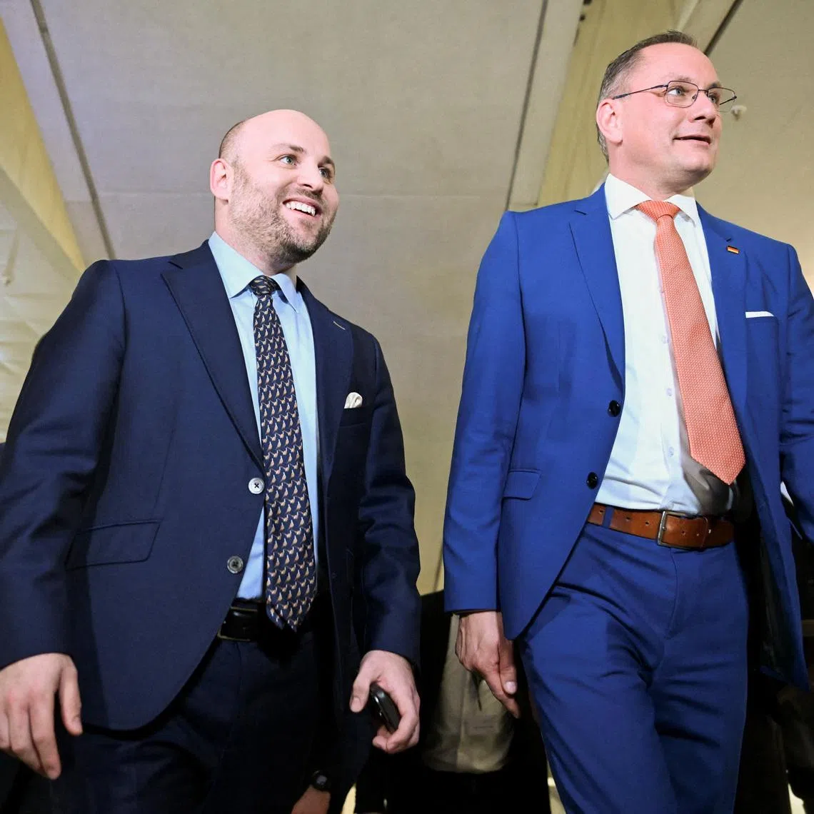 Markus Frohnmaier, top candidate of the far-right Alternative for Germany (AfD) party, and Tino Chrupalla, co-leader of Germany's far-right Alternative for Germany (AfD) party, arrive at the state parliament, the Landtag, of Baden-Wuerttemberg, following the exit poll results in Stuttgart, Germany, March 8, 2026. REUTERS/Jana Rodenbusch/File Photo