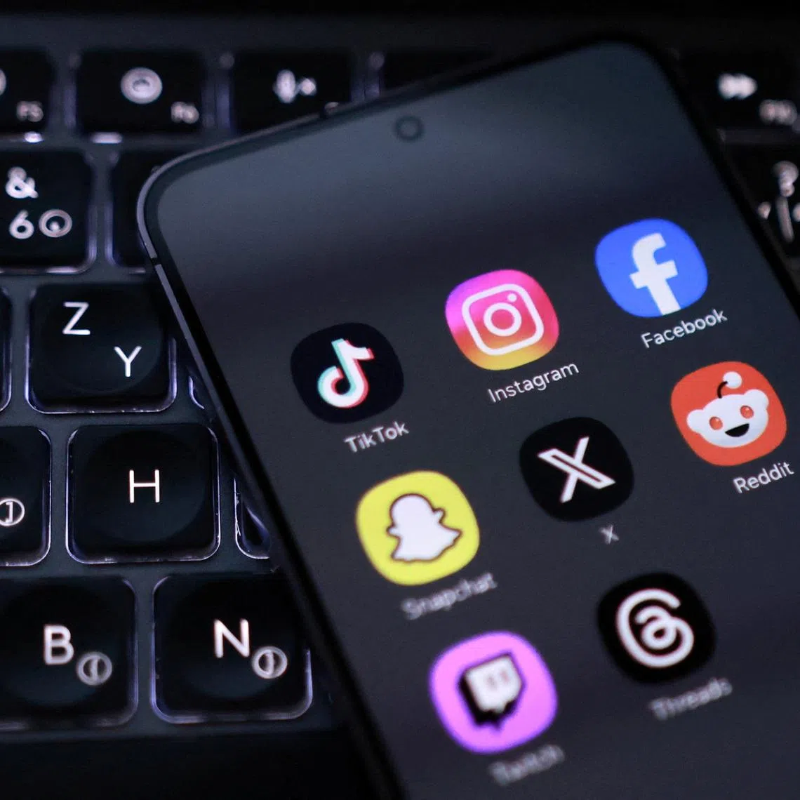 A smartphone with displayed social app icons in this illustration taken February 3, 2026. REUTERS/Dado Ruvic/Illustration