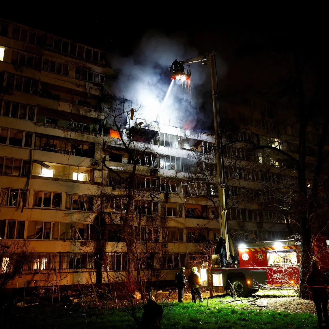 Firefighters work at the site of an apartment building hit by a Russian drone strike, amid Russia’s attack on Ukraine, in Kyiv, Ukraine November 25, 2025. REUTERS/Valentyn Ogirenko