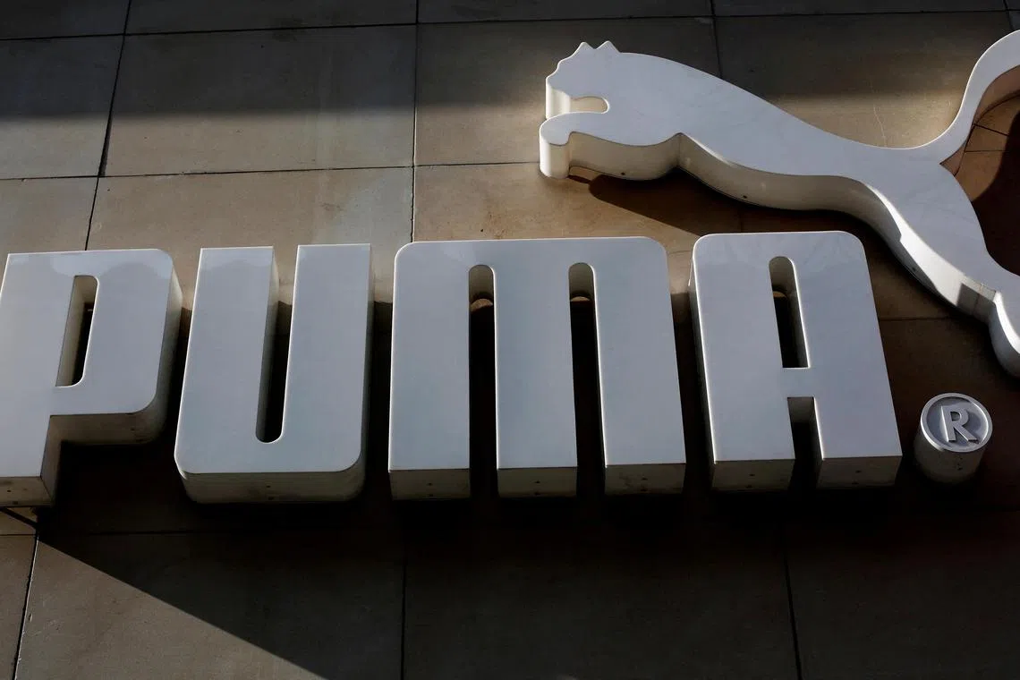 The logo of German sports goods firm Puma is seen at the entrance of one of its stores in Vienna, Austria.