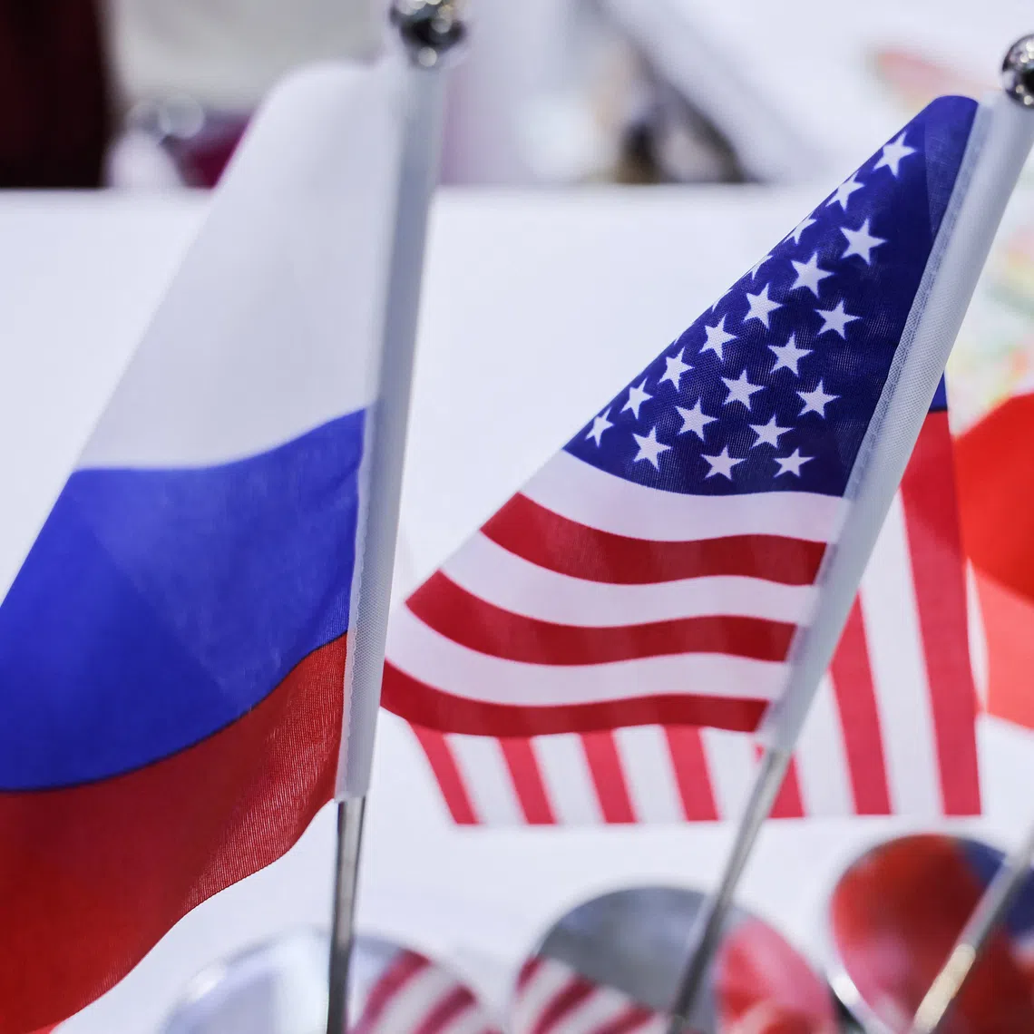 National flags of the U.S and Russia are placed on a table at a booth at the China International Fair for Trade in Services (CIFTIS) in Beijing, China, September 11, 2025. REUTERS/Maxim Shemetov
