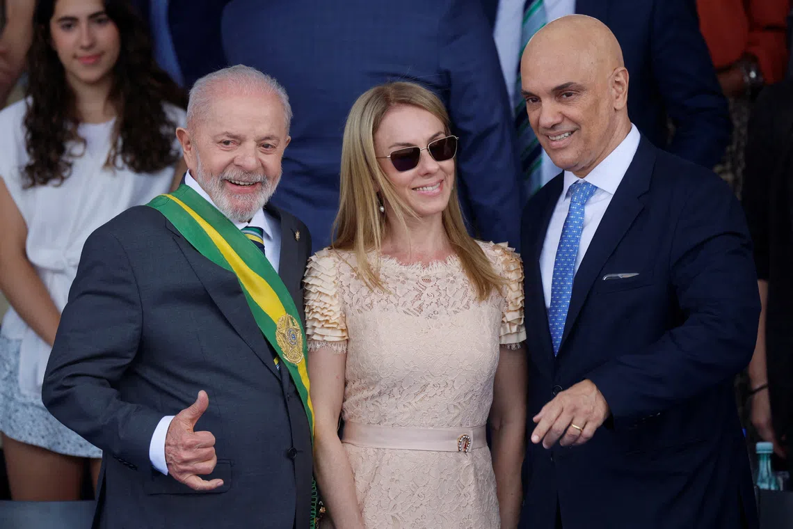 FILE PHOTO: Brazil's President Luiz Inacio Lula da Silva poses for a picture with Brazil's Supreme Court Judge Alexandre de Moraes and his wife Viviane Barci de Moraes during the Independence Day parade in Brasilia, Brazil September 7, 2024. REUTERS/Adriano Machado/File Photo