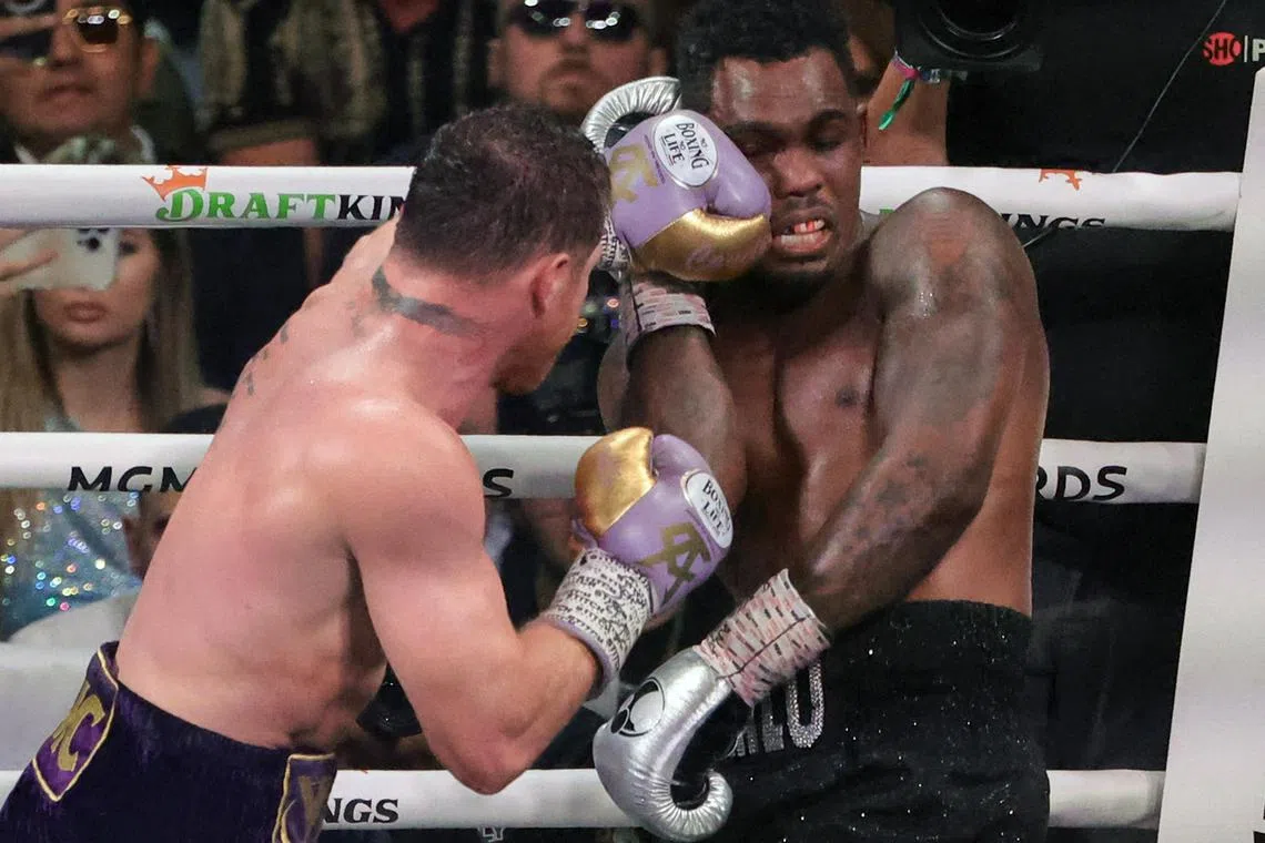 Saul "Canelo" Alvarez hitting Jermell Charlo in the 10th round of their super middleweight title fight at T-Mobile Arena on Saturday in Las Vegas, Nevada. Alvarez won by unanimous decision. 