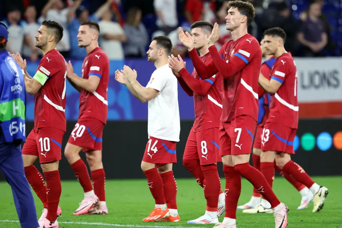 Serbia players applauding their fans after losing 1-0 to England in their Euro 2024 group C match in Gelsenkirchen, Germany in June 16, 2024. 