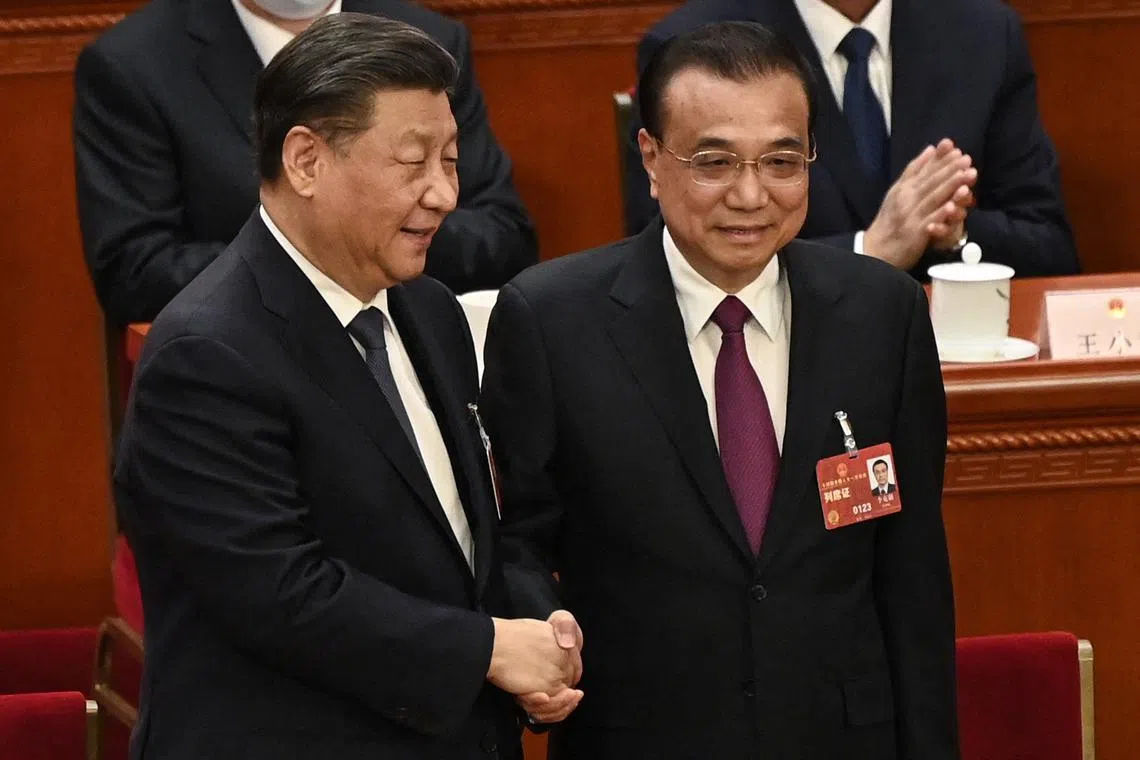 Chinese President Xi Jinping (left) with former Premier Li Keqiang during the fourth plenary session of the National People's Congress in Beijing in March.