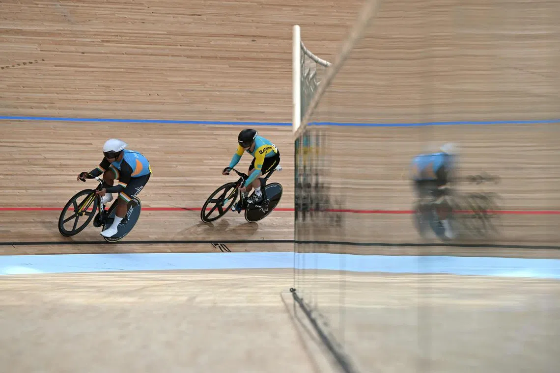 India's David Beckham Elkatohchoongo (left) competing during the individual sprint qualifying at the Asian Games.