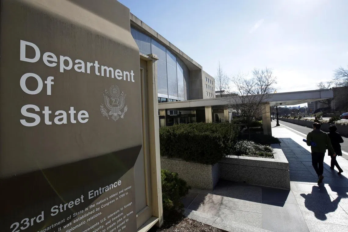 FILE PHOTO: People enter the State Department Building in Washington, U.S., January 26, 2017. REUTERS/Joshua Roberts/File Photo