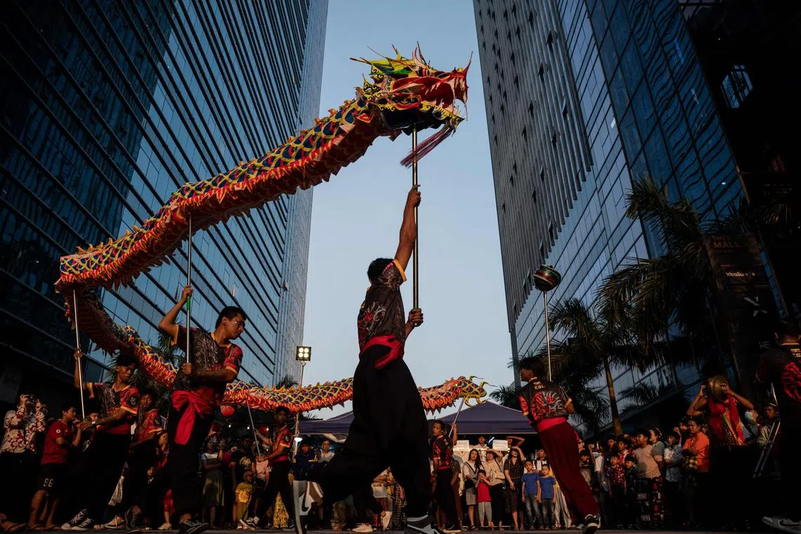 A dragon dance team performing on a street in Yangon on Feb 10, 2024, on the first day of the Lunar New Year of the Dragon.