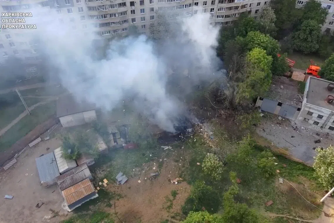 Smoke rises in the aftermath of a Russian strike, amid Russia's attack on Ukraine, in Kharkiv, Ukraine, May 14, 2024 in this still image taken from video.   Kharkiv Regional Prosecutor's Office/Handout via REUTERS/ File Photo