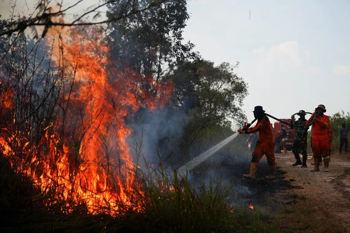 Indonesia races to contain fires as haze spreads