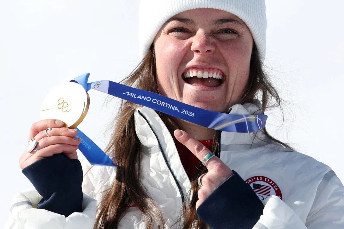 Milano Cortina 2026 Olympics - Alpine Skiing - Women's Downhill Victory Ceremony - Tofane Alpine Skiing Centre, Belluno, Italy - February 08, 2026. Gold medallist Breezy Johnson of United States celebrates on the podium after winning the women's downhill REUTERS/Leonhard Foeger