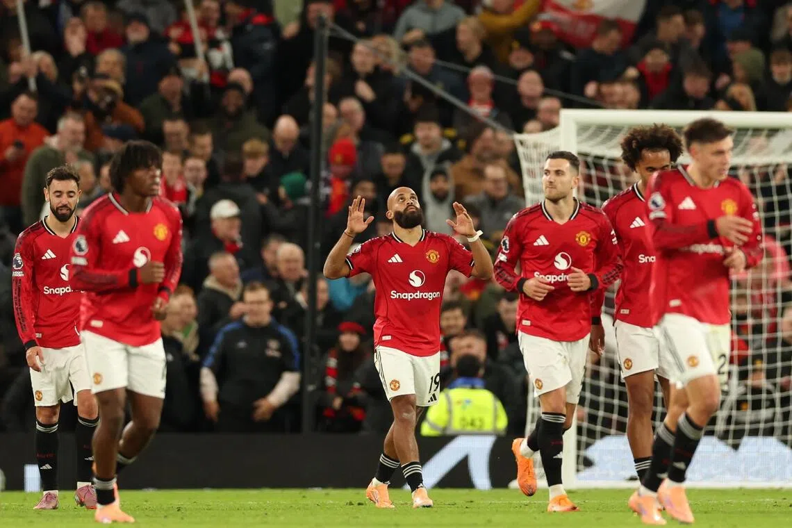Manchester United's Bryan Mbeumo (centre) celebrates scoring his team's fourth goal against Brighton.