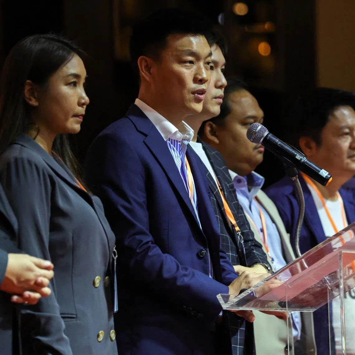 People's Party leader Natthaphong Ruengpanyawut speaks alongside party members of parliament during a press conference following Thailand's Supreme Court's acceptance of a petition that accuses 44 current and former opposition lawmakers of ethics violations over their attempt in 2021 to amend a law that protects the monarchy from criticism, in Bangkok, Thailand, April 24, 2026. REUTERS/Athit Perawongmetha