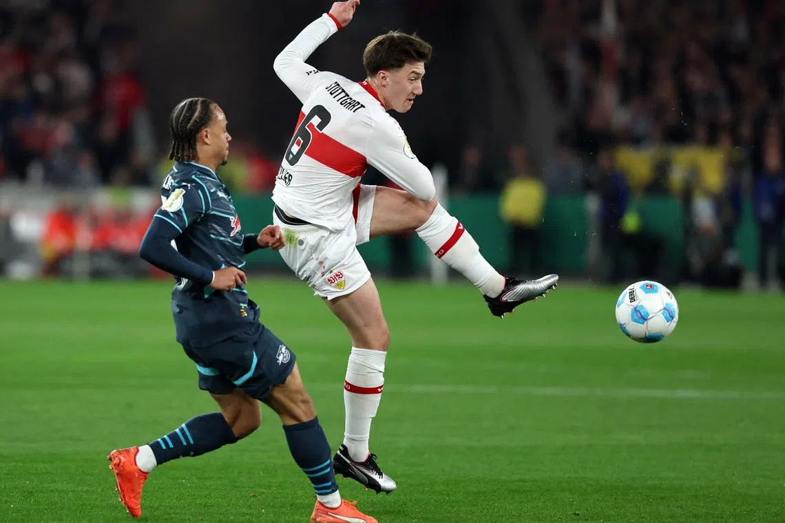 FILE PHOTO: Soccer Football - DFB Cup - Semi Final - VFB Stuttgart v RB Leipzig - MHPArena, Stuttgart, Germany - April 2, 2025 VfB Stuttgart's Angelo Stiller in action with RB Leipzig's Xavi Simons REUTERS/Kai Pfaffenbach/File Photo