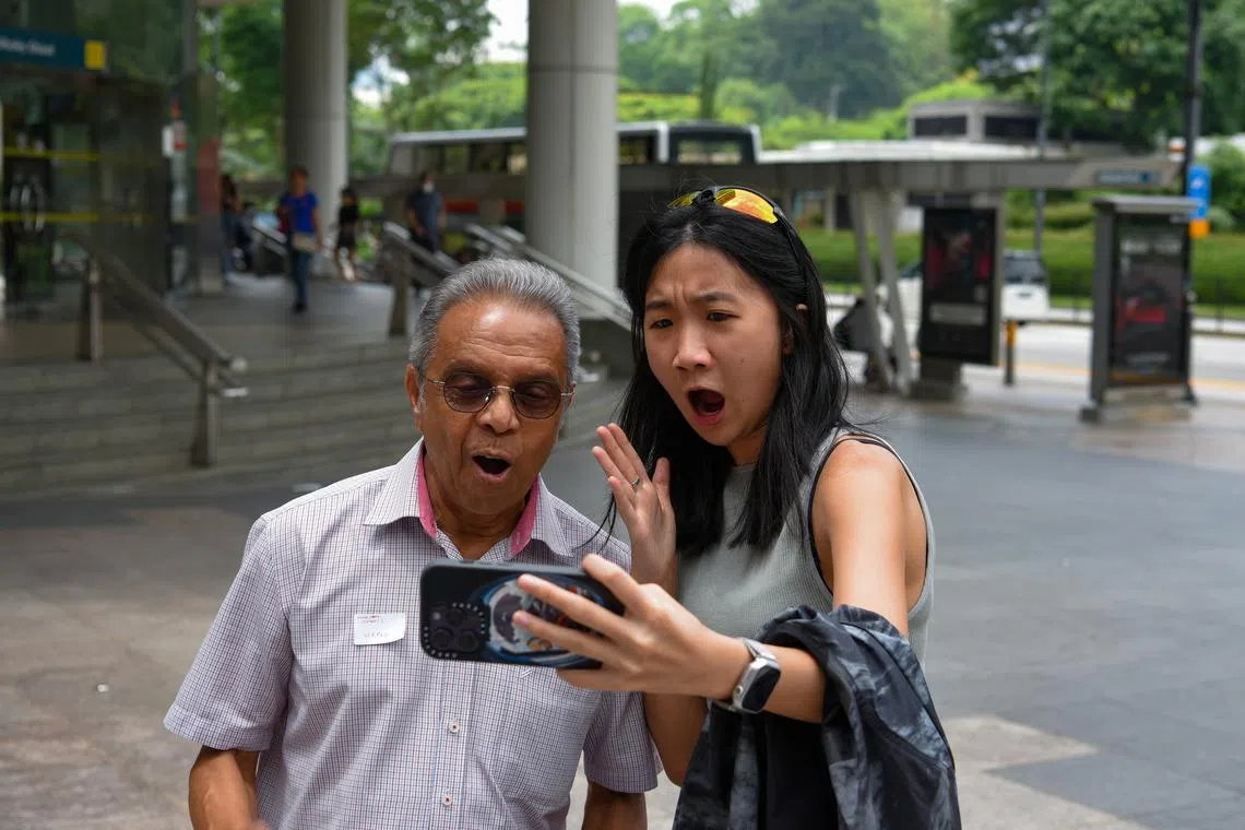 GenDate participants taking a selfie as part of the treasure hunt segment of the Intergenerational Bonding Workshop, on April 29, 2023.