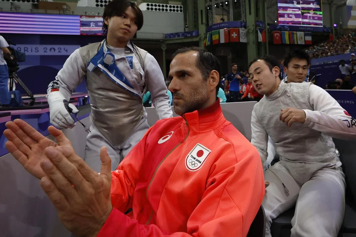 Paris 2024 Olympics - Fencing - Men's Foil Team Table of 8 - Grand Palais, Paris, France - August 04, 2024. Japan coach Erwann Lucien Edouard Le Pechoux reacts. REUTERS/Albert Gea