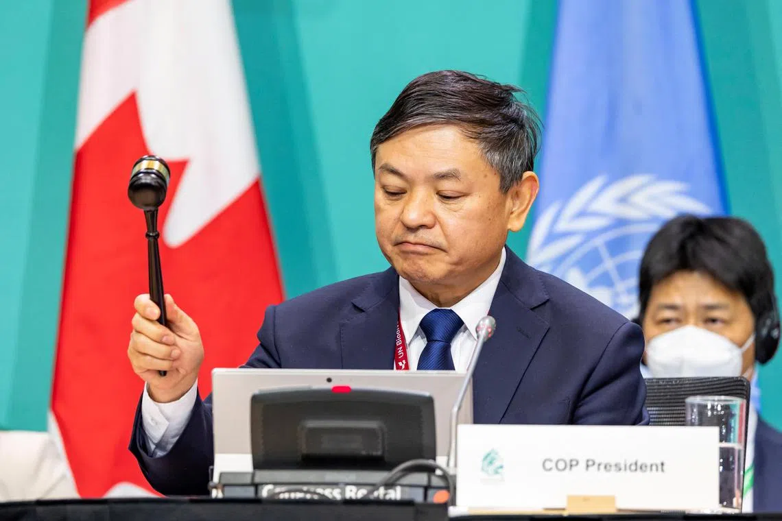 The president of the UN-backed COP15 biodiversity conference, China's Minister of Ecology and Environment Huang Runqiu, lowering the gavel to pass the historic nature deal. 