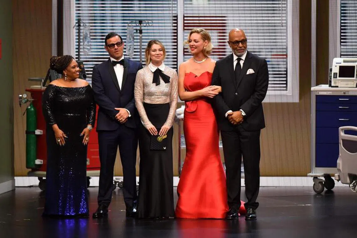 Grey's Anatomy's original cast members (from left) Chandra Wilson, Justin Chambers, Ellen Pompeo, Katherine Heigl and James Pickens Jr. reunite onstage during the 75th Emmy Awards at the Peacock Theatre in Los Angeles on January 15, 2024. (Photo by Valerie Macon / AFP)