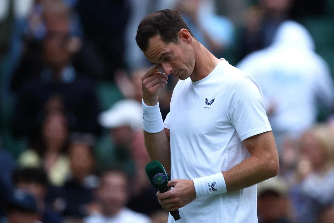 Britain's Andy Murray emotional after losing in the men's doubles first-round Wimbledon match with teammate and brother Jamie on July 4.