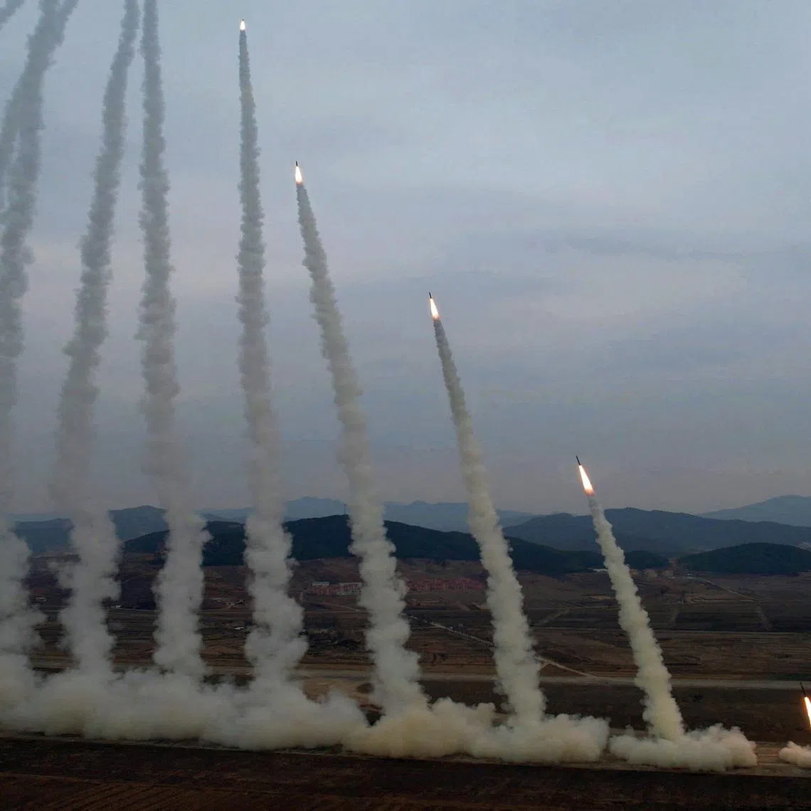 FILE PHOTO: A test-launch of 600 mm-calibre multiple rocket launchers is overseen by North Korean leader Kim Jong Un (not pictured), North Korea, March 14, 2026, in this picture released by North Korea's official Korean Central News Agency. KCNA via REUTERS/File Photo