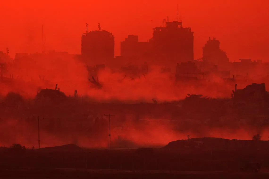 Destroyed buildings in the Gaza Strip at sunset as seen from across the border in southern Israel on July 15, 2025. 