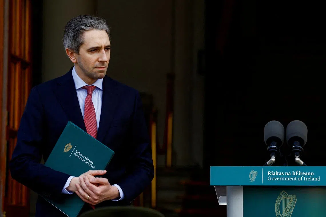 FILE PHOTO: Ireland's Taoiseach (Prime Minister) Simon Harris stands on the day of his meeting with Spain's Prime Minister Pedro Sanchez to discuss recognising the Palestinian state, in Dublin, Ireland, April 12, 2024. REUTERS/Clodagh Kilcoyne/File Photo