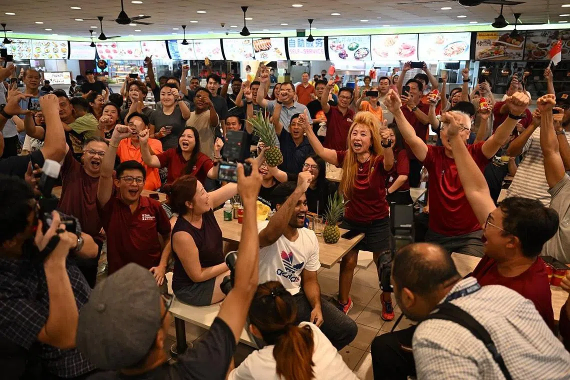 Supporters of Mr Tharman Shanmugaratnam celebrating after the official results were released, at a coffeeshop at Yung Sheng Road on Sept 2, 2023.