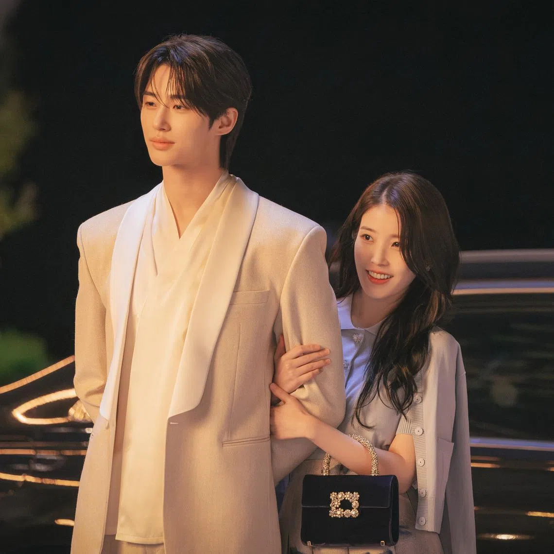 Byeon Woo-seok (left) and IU in Perfect Crown.