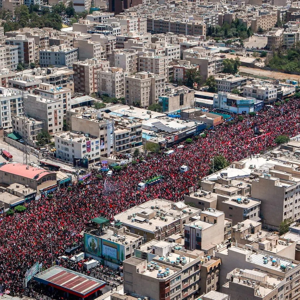People attend a funeral procession for Iran’s late Supreme Leader Ayatollah Ali Khamenei in Tehran, Iran, on July 6.
