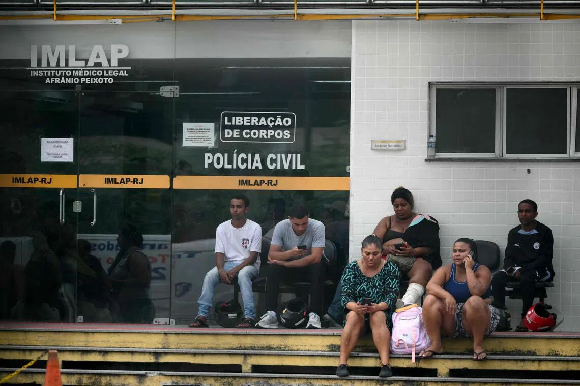 Relatives wait outside the AfrAnio Peixoto Medico-Legal Institute (IMLAP) to retrieve the bodies of their loved ones killed during Operacao Contencao (Operation Containment) in the Penha Complex, in Rio de Janeiro, Brazil, on October 29, 2025. The Rio de Janeiro public defender's office on Wednesday said a total of 132 people died in the bloodiest police raid against drug gangs in the Brazilian city's history, as grieving residents laid out dozens of bodies in the street. (Photo by Mauro PIMENTEL / AFP)