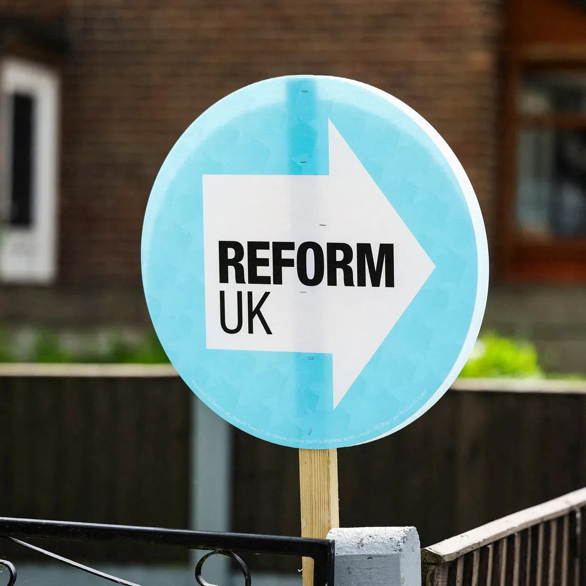 FILE PHOTO: A campaign placard for the Reform UK party is displayed outside a residential property at Bolton Road, ahead of the Makerfield by-election, in Ashton-in-Makerfield, Britain, June 5, 2026. REUTERS/Temilade Adelaja/File Photo