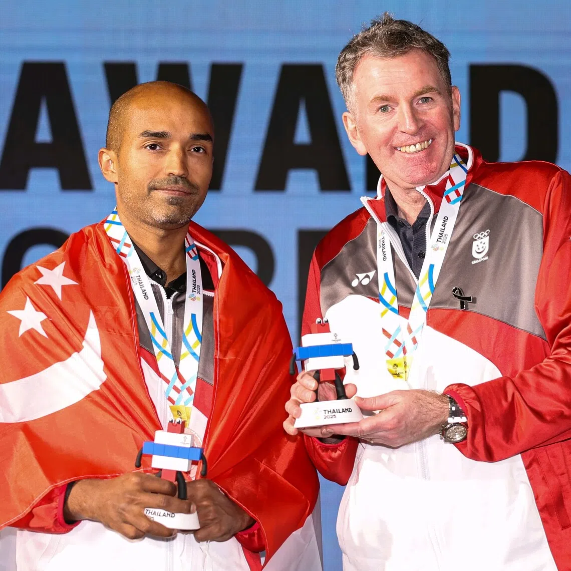 Singapore’s Karthik Ramaswamy (left) and Peter Gilchrist with their silver medals after the English billiards men’s team final on Dec 14.