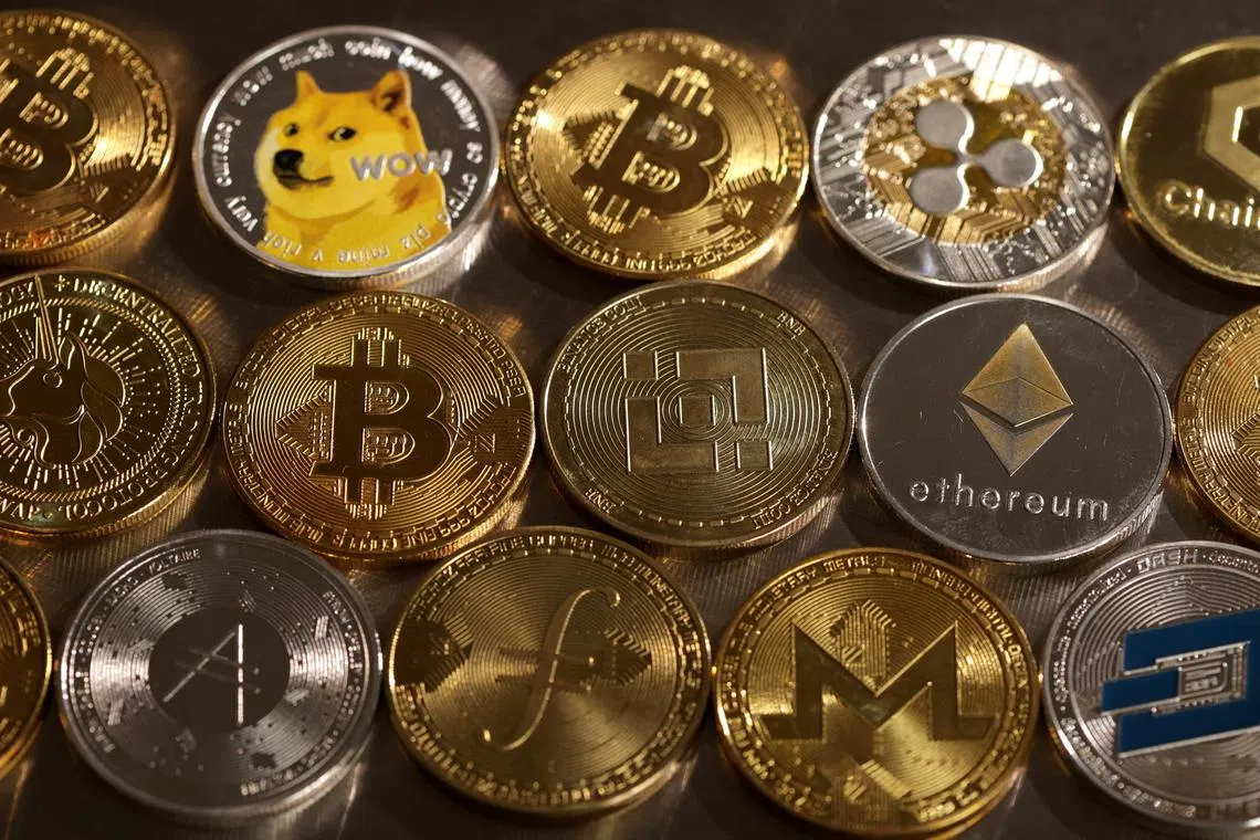 FILE PHOTO: Representations of cryptocurrencies are seen in this illustration, August 10, 2022. REUTERS/Dado Ruvic/Illustration/File Photo
