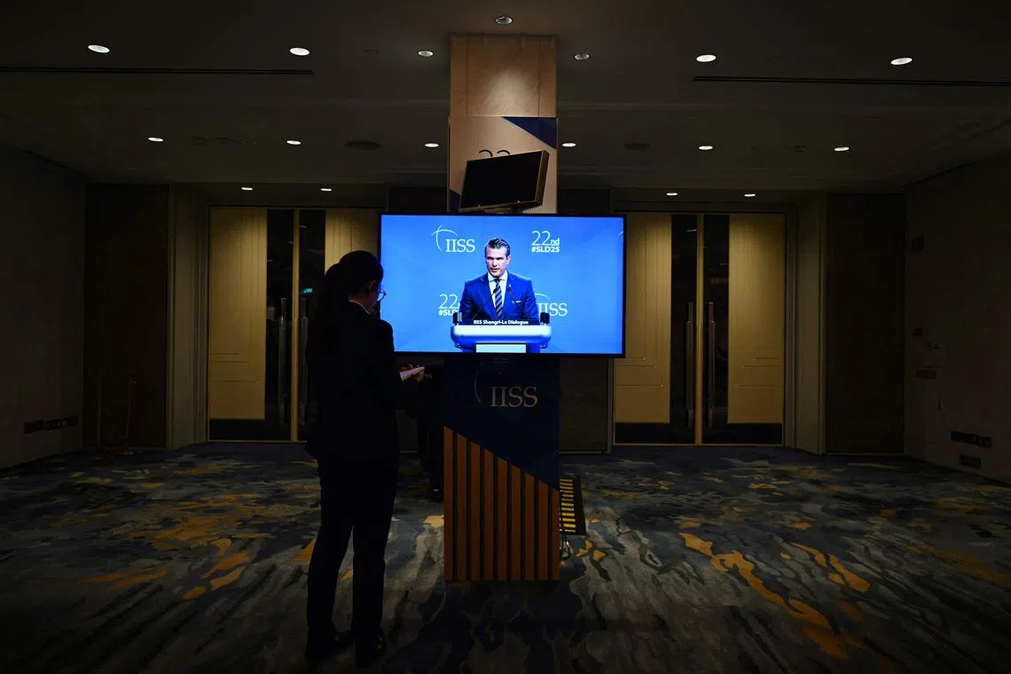 US Defence Secretary Pete Hegseth seen on a monitor delivering an address at the Shangri-La Dialogue security summit in Singapore on May 31.
