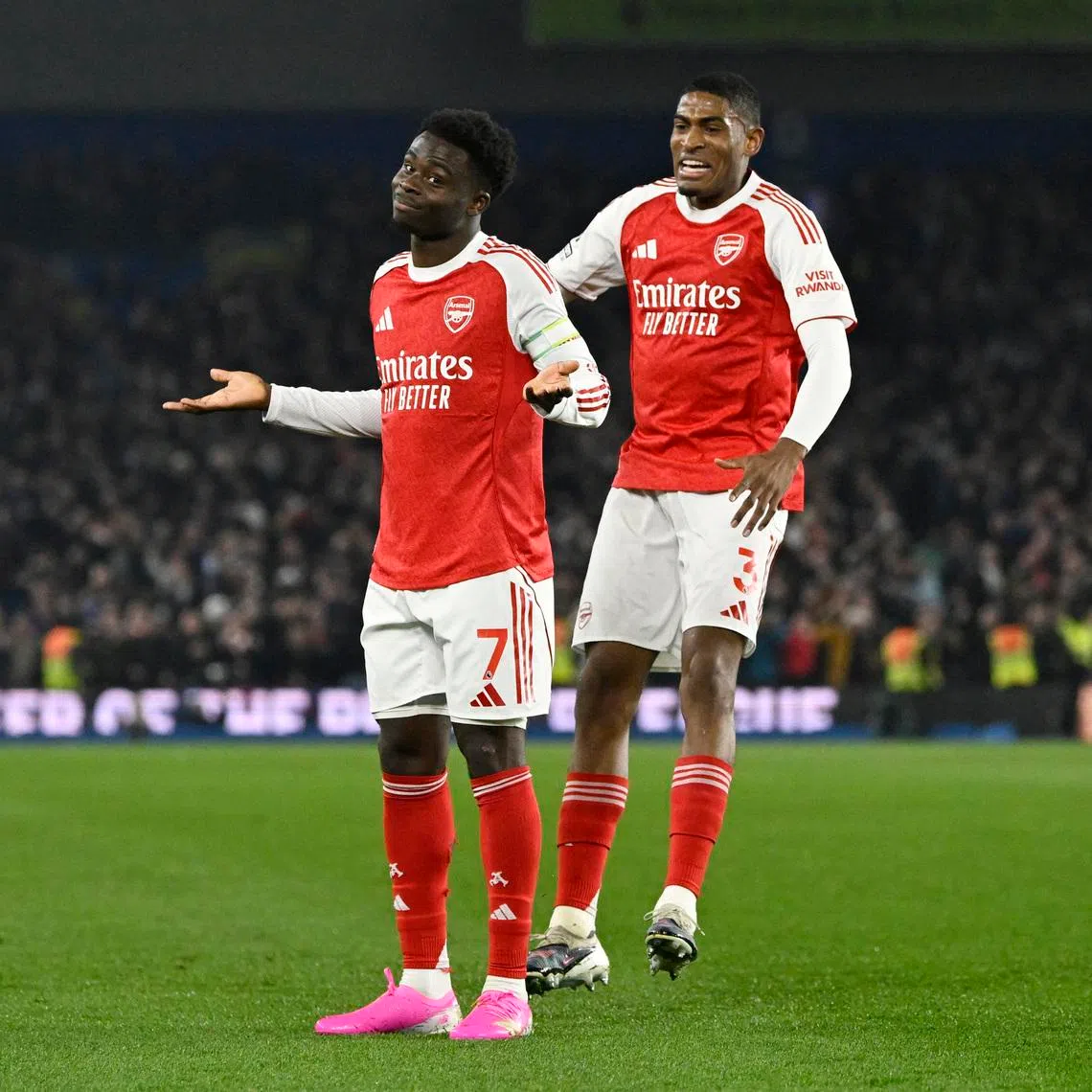 Soccer Football - Premier League - Brighton & Hove Albion v Arsenal - The American Express Community Stadium, Brighton, Britain - March 4, 2026 Arsenal's Bukayo Saka celebrates scoring their first goal with Cristhian Mosquera REUTERS/Tony O Brien