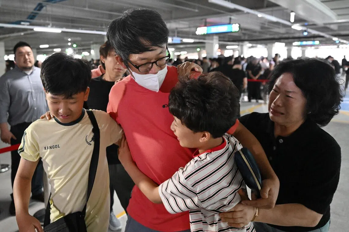 A South Korean worker detained during a US immigration raid at a US Hyundai plant returns to his family in Incheon.
