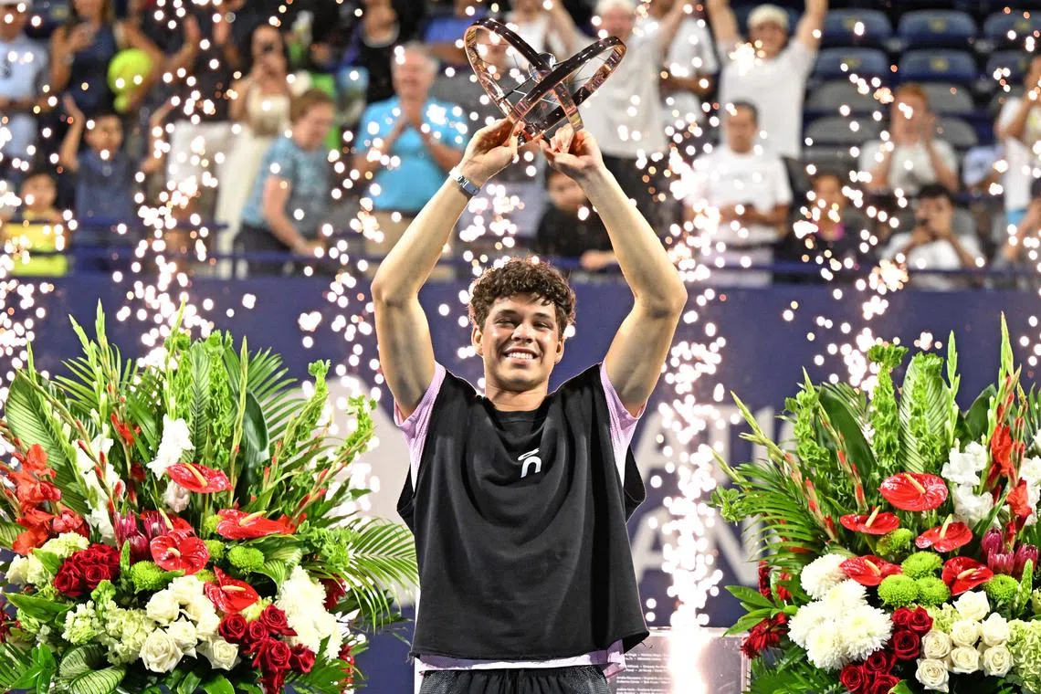 Ben Shelton lifts the trophy after defeating Karen Khachanov in the final in Toronto.