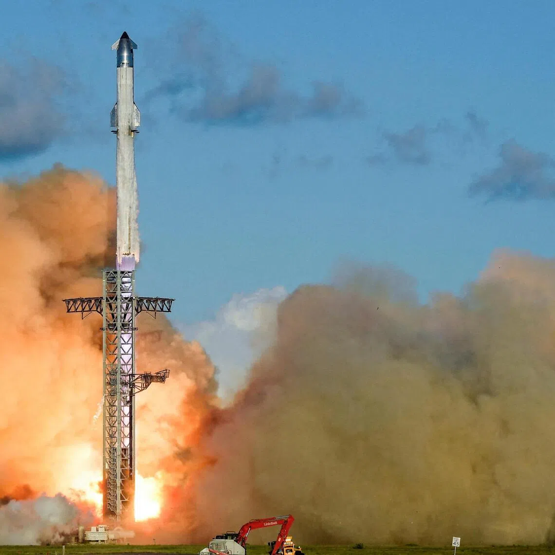 A SpaceX Super Heavy booster carrying the Starship spacecraft lifts off on its 11th test flight at the company's launch pad in Starbase, Texas, on Oct 13.