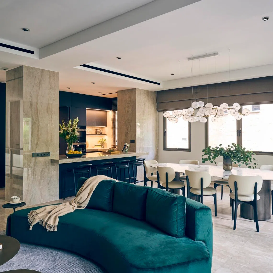 Clean curves, sculptural fixtures and vertical lines define this elegant Tanglin townhouse.