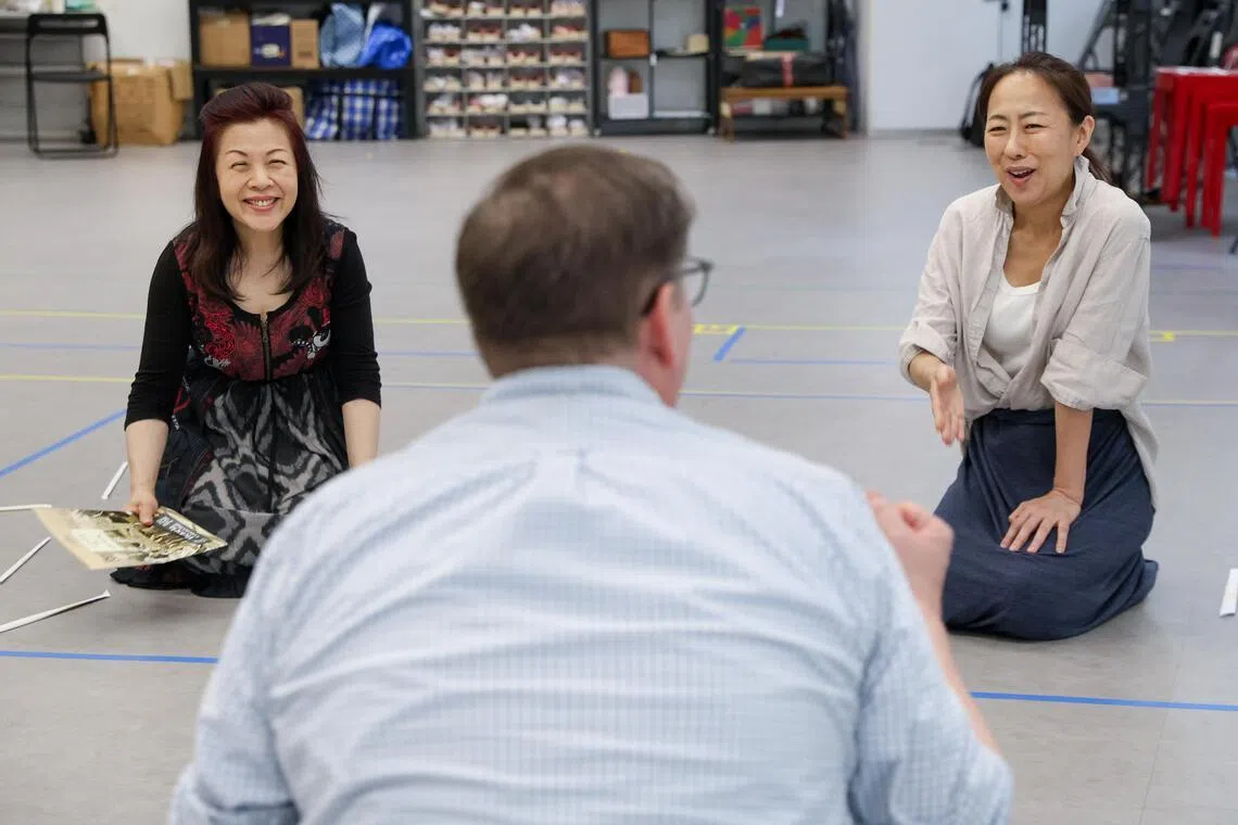 Soprano Nancy Yuen, opera director Harry Fehr and mezzo-soprano Yuka Kobayashi discuss a scene during rehearsals.