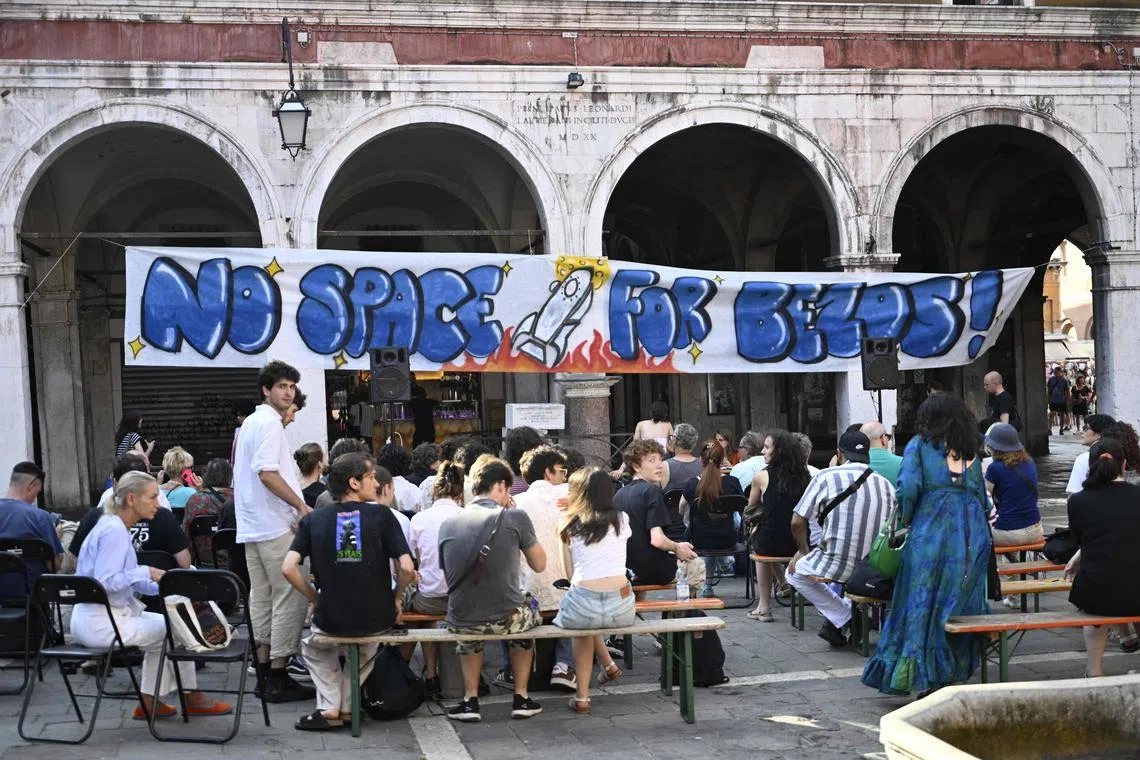 People gather to protest against the planned wedding of Amazon Founder and CEO Jeff Bezos and journalist Lauren Sanchez in Venice. 