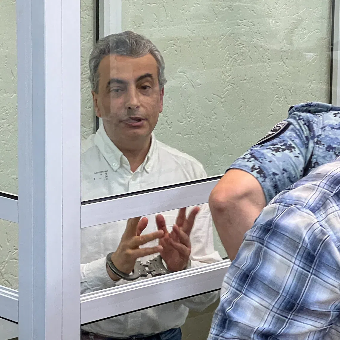 Yabloko party deputy chairman Lev Shlosberg, accused of discrediting Russia's armed forces and spreading false information about them, attends a court hearing in Pskov, Russia, August 17, 2026. REUTERS/Dmitry Vasilyev