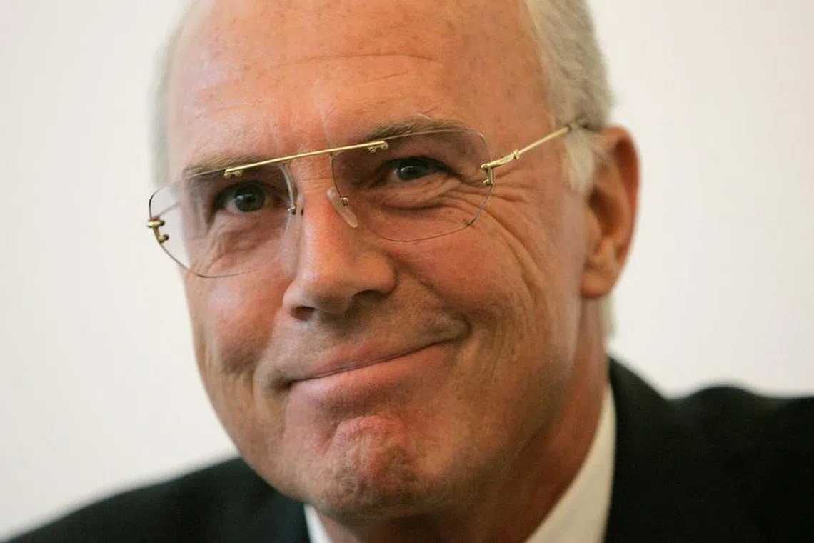 FILE PHOTO: Franz Beckenbauer, German President of the World Cup 2006 organising committee, smiles during a news conference before the 'Prize Herbert' award ceremony in Interlaken, Switzerland July 6, 2007. REUTERS/Stefan Wermuth/File Photo