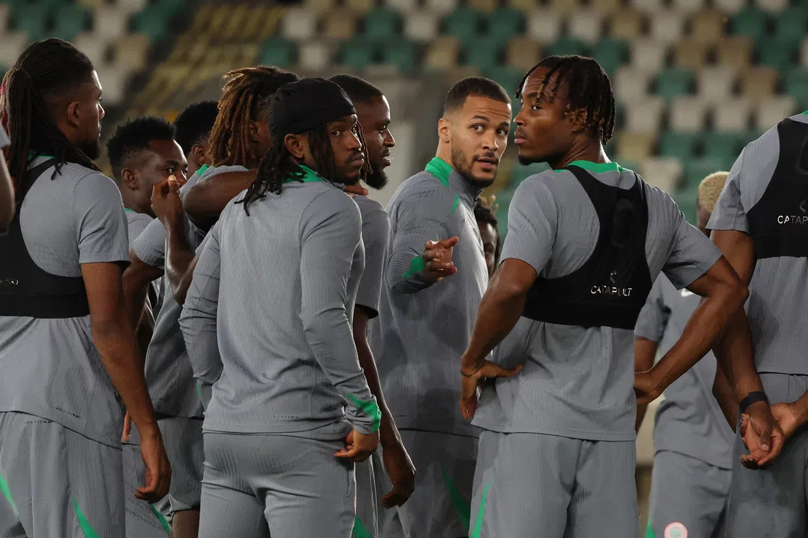 Soccer Football - FIFA World Cup - CAF Qualifiers - Nigeria Training - Godswill Akpabio International Stadium, Uyo, Nigeria - October 13, 2025 Nigeria's William Troost-Ekong with teammates during training REUTERS/Sodiq Adelakun