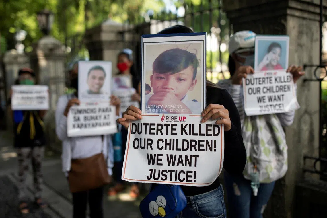 Relatives of drug war victims hold a protest in Manila, on June 30, 2021.