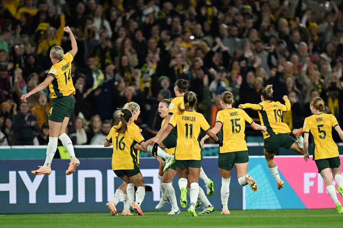 FILE PHOTO: Soccer Football - FIFA Women’s World Cup Australia and New Zealand 2023 - Group B - Australia v Republic of Ireland - Stadium Australia, Sydney, Australia - July 20, 2023 Australia's Steph Catley celebrates scoring their first goal with teammates REUTERS/Jaimi Joy/File Photo