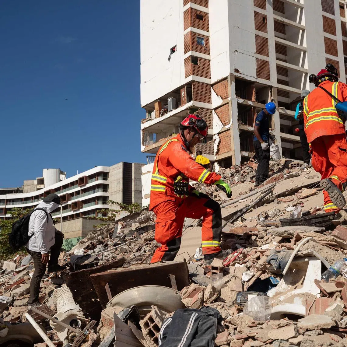 British rescuers search for missing persons in La Guaira, Venezuela on June 29.