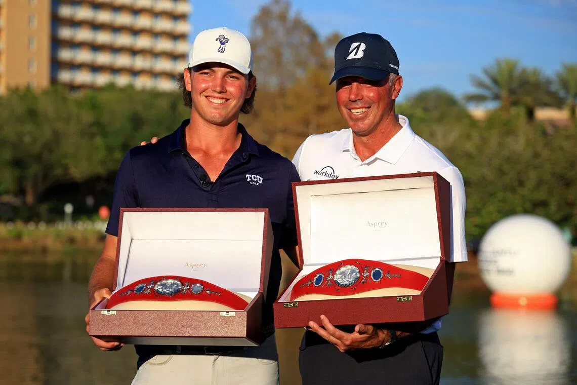 Cameron Kuchar and Matt Kuchar pose with the Willie Park Belts after winning the PNC Championship.