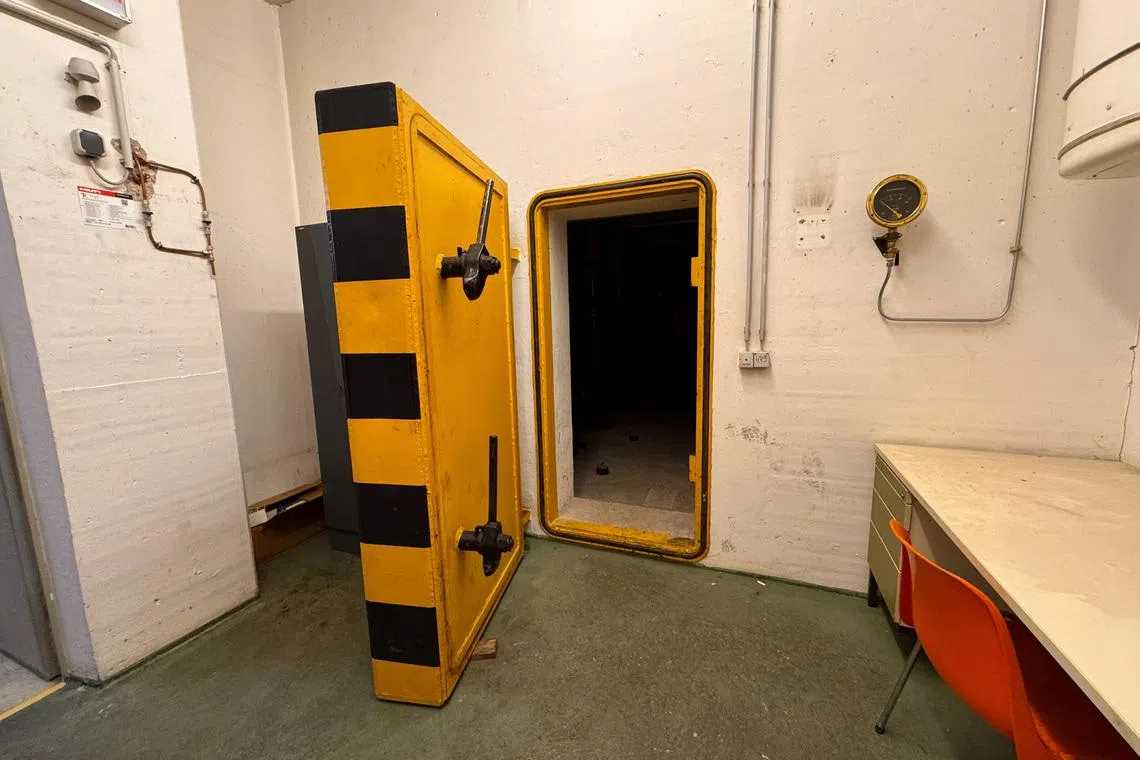 A yellow marked door is pictured in a civil defence shelter in Munich, Germany, December 6, 2024.     REUTERS/Christine Uyanik