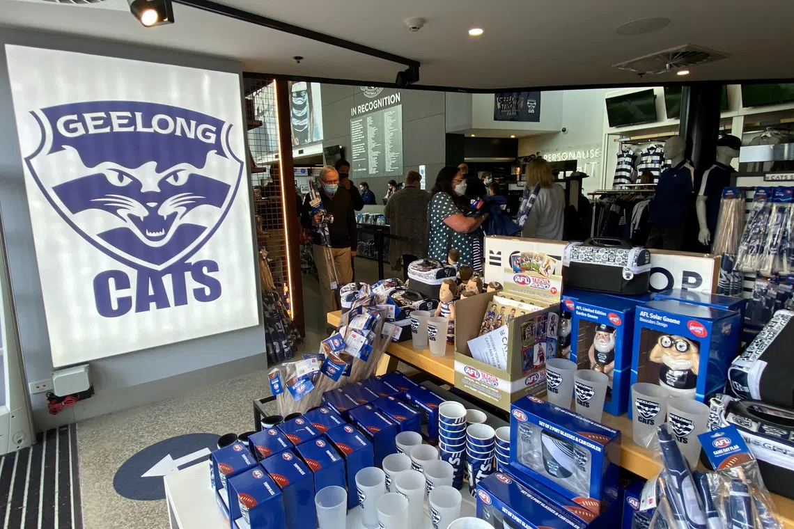 Football fans buy merchandise at a shop at Kardinia Park, home stadium of Australian Rules football team Geelong Cats in Geelong, Australia October 23, 2020.  REUTERS/Ian Ransom